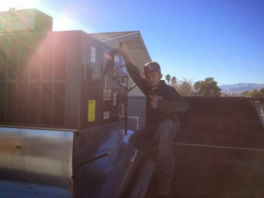 HVAC technician performing HVAC Inspection on a rooftop unit in East Lampeter